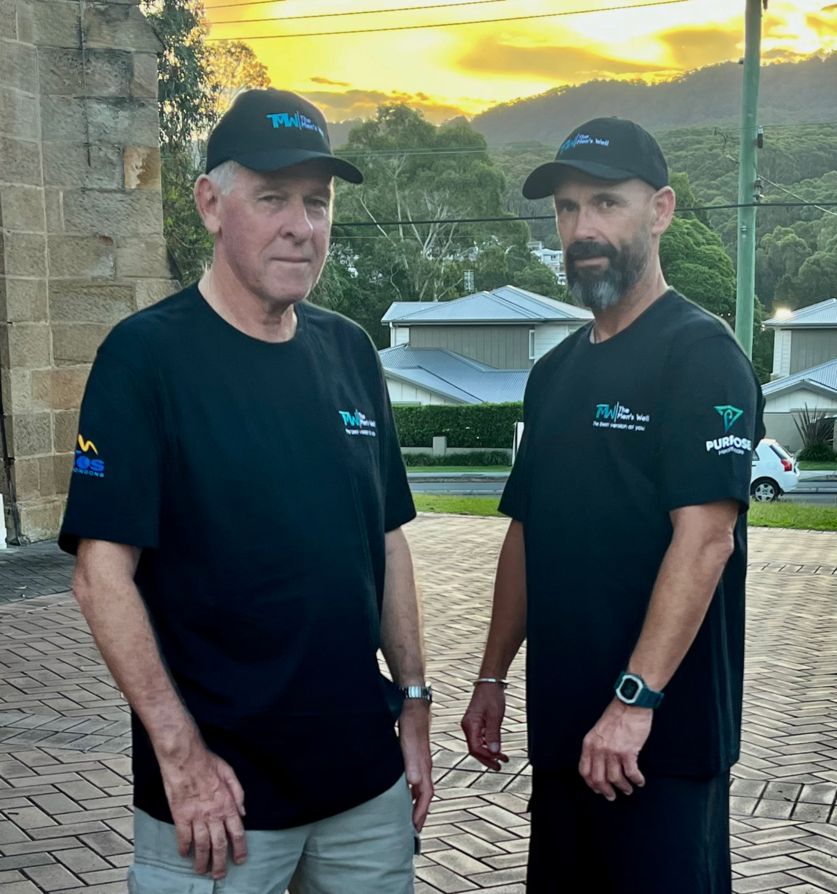 Two men from The Men's Well group standing together